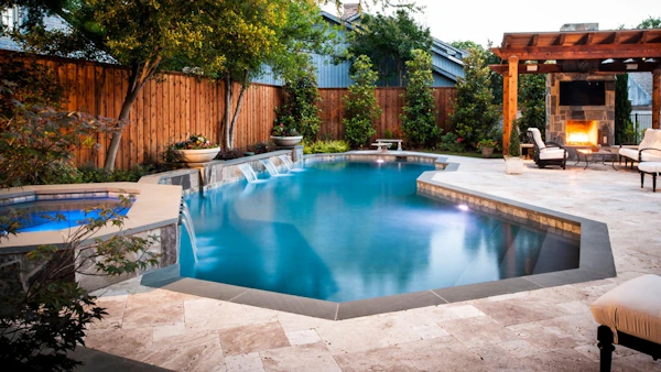 An Outdoor Fireplace by the Pool